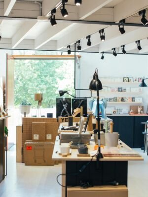 Trendy store interior featuring a female customer browsing surrounded by chic decor.